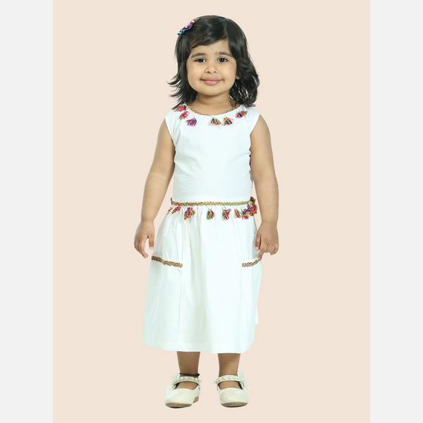 White pure cotton sleeveless dress embellished with tussle