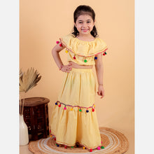 Yellow pure cotton crop top and long skirt embellished with pompom tussal