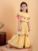 Yellow pure cotton crop top and long skirt embellished with pompom tussal